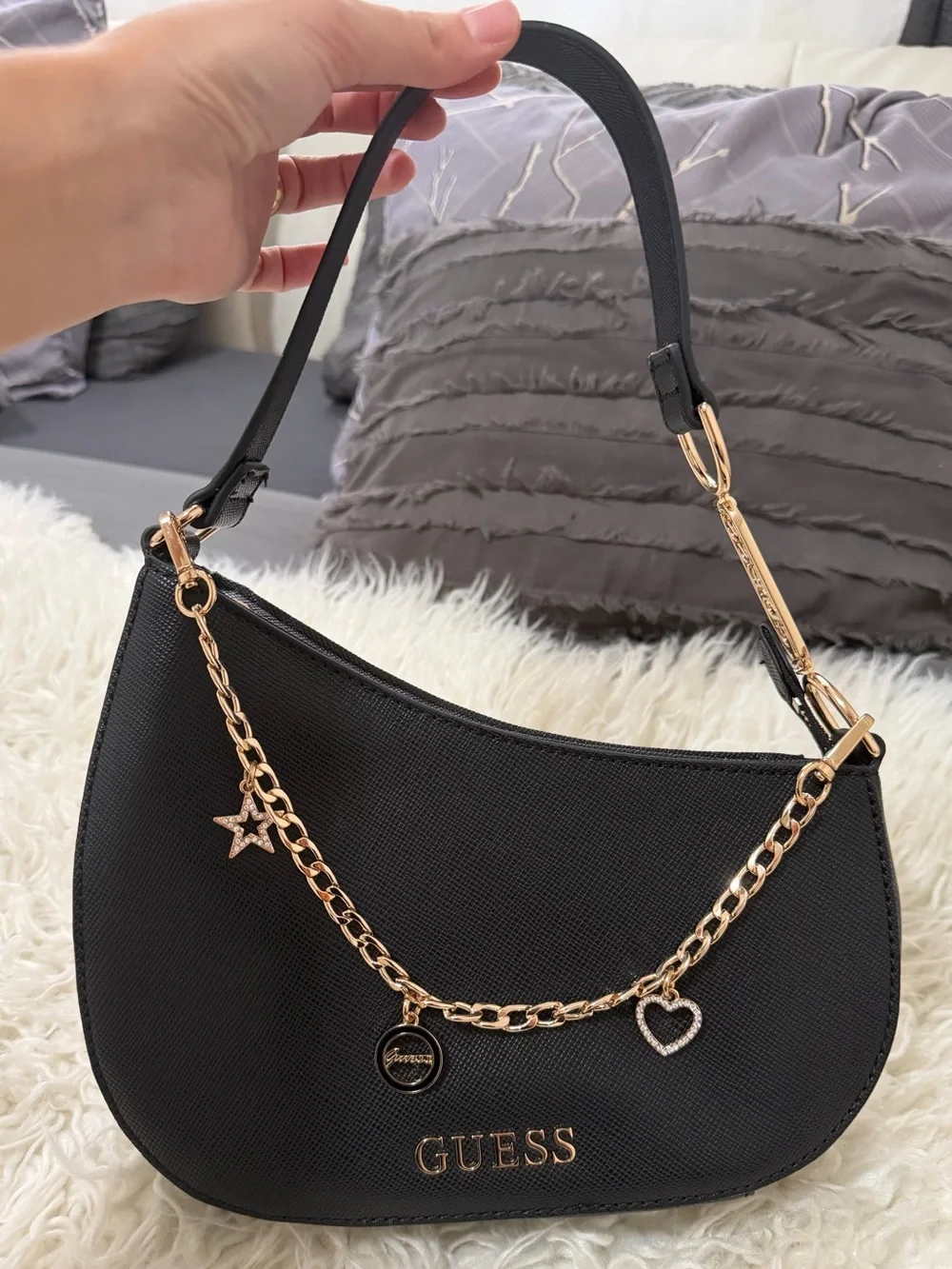 GUESS Black Crescent Shoulder Bag with Gold Charm Chain Accents
